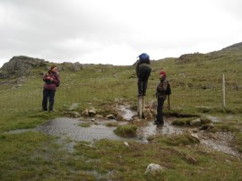 Chris negotiating the stile